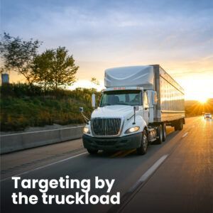 A semi-truck driving on interstate representing North Dakota Motor Carriers Association with the text 